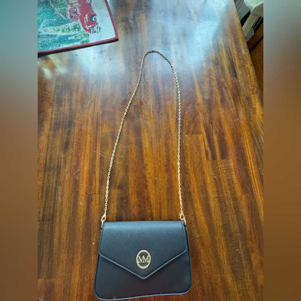 black bag with gold chain